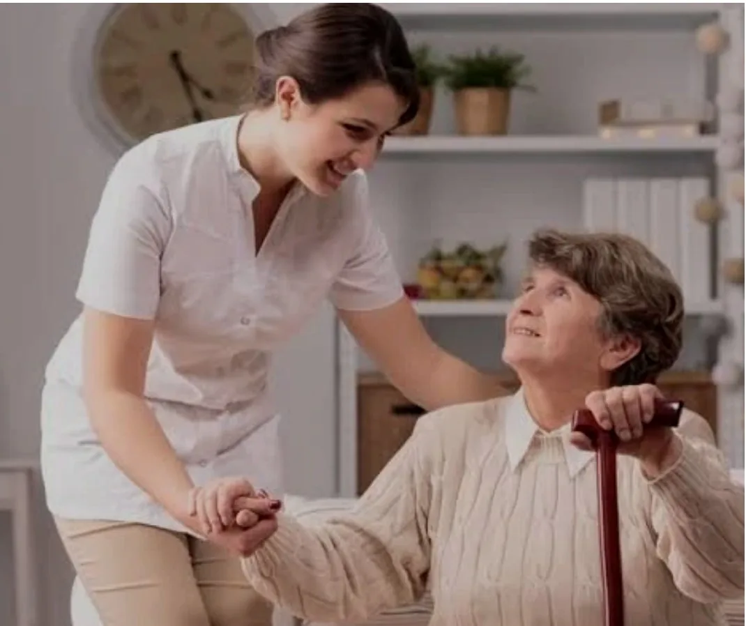 A caregiver helping a client at home